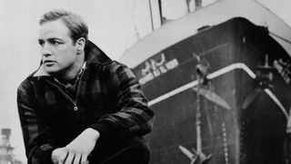 Marlon Brando broods in front of a ship in On the Waterfront