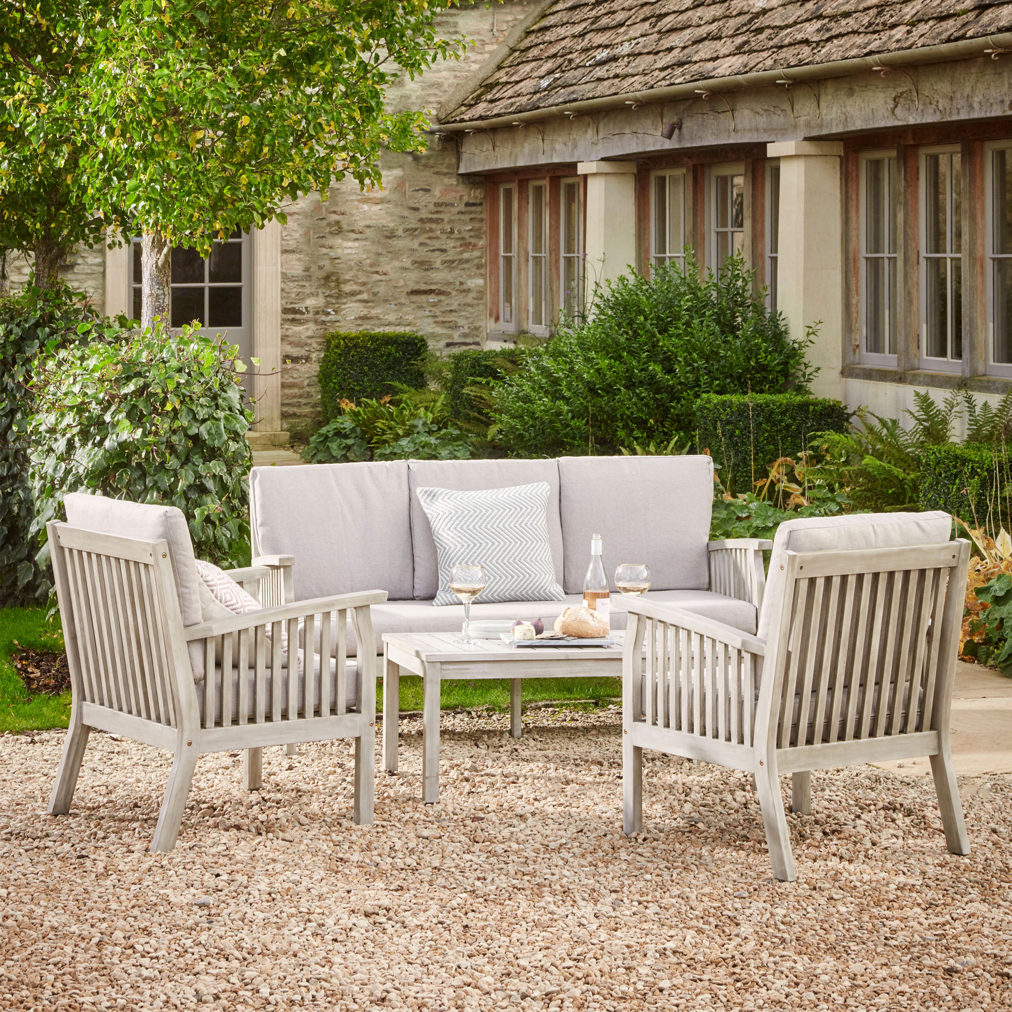 A wooden outdoor lounge set