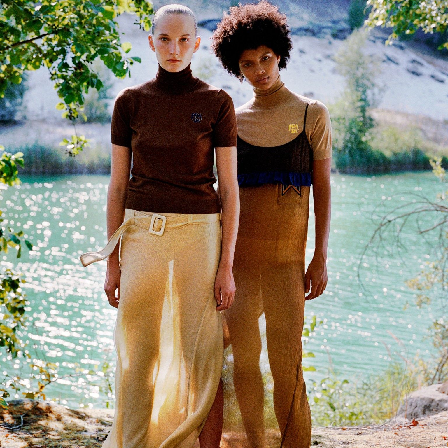 Two women standing in lightweight dresses and summer apparel