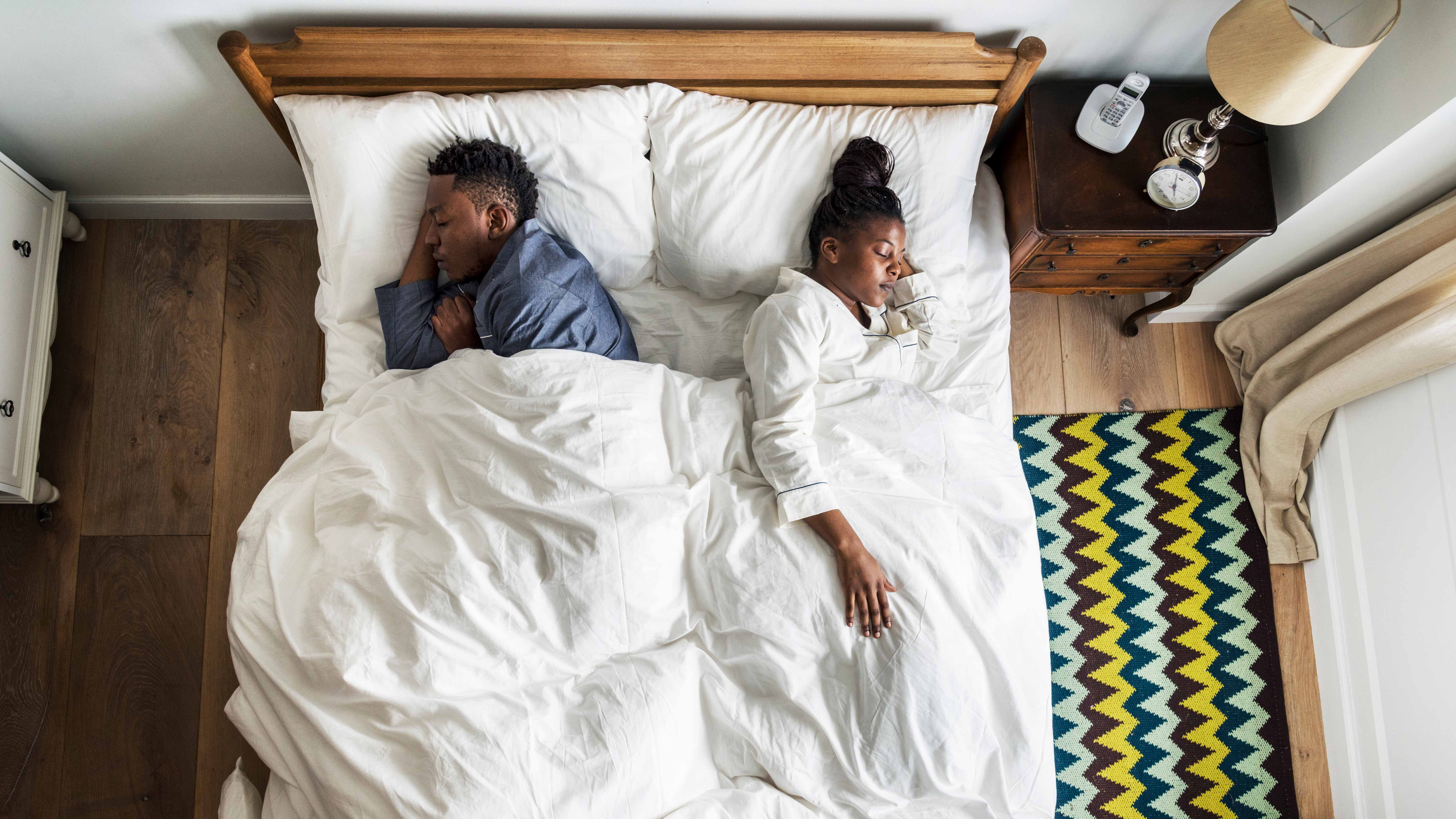 Black Friday mattress deals: couple lying in bed