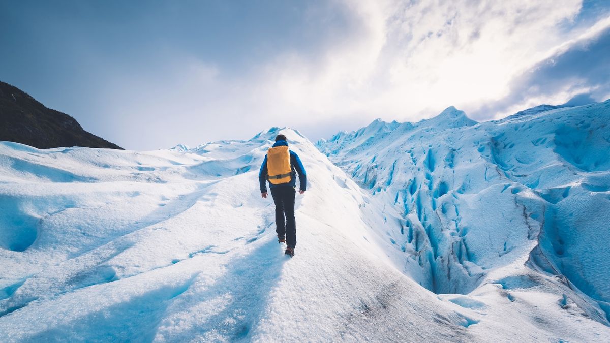 fastpacker in snowy mountains