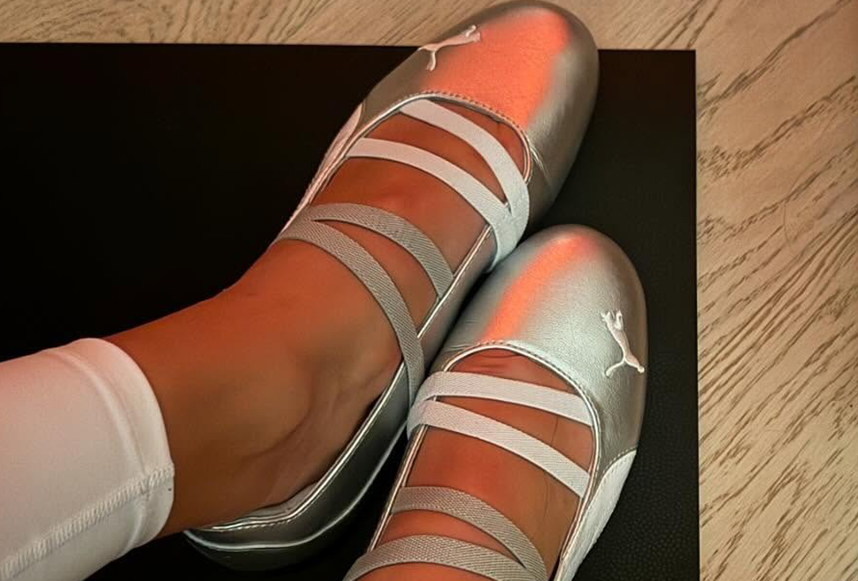 Woman wearing metallic Puma Speedcat Ballet sneaker.