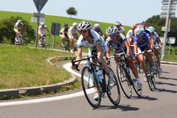 Eventual stage winner, Ruth Corsett (Australia) leads the break through a corner
