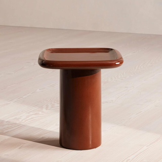 outdoor side table with pedestal base and wood-like finish