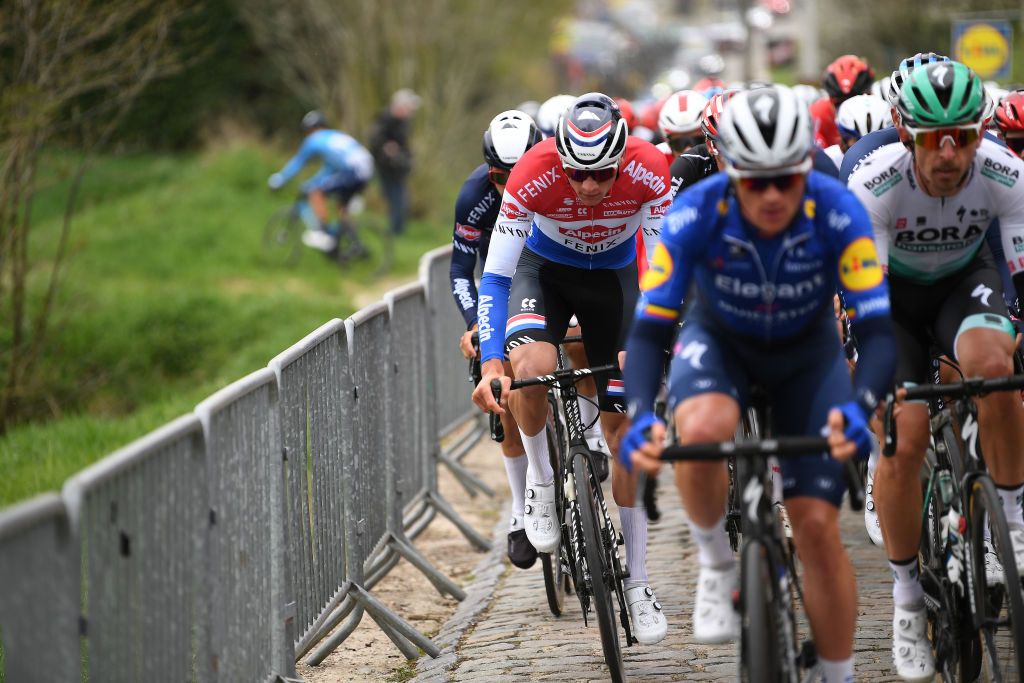 OUDENAARDE BELGIUM APRIL 04 Mathieu Van Der Poel of Netherlands and Team AlpecinFenix during the 105th Ronde van Vlaanderen Tour of Flanders 2021 Mens Elite a 2515km race from Antwerp to Oudenaarde Kortekeer Cobblestones sector RVV21 rondevanvlaanderen tourofflanders on April 04 2021 in Oudenaarde Belgium Photo by Tim de WaeleGetty Images
