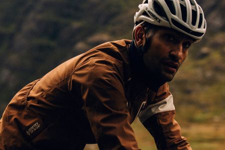 Male rider wearing Rapha jacket