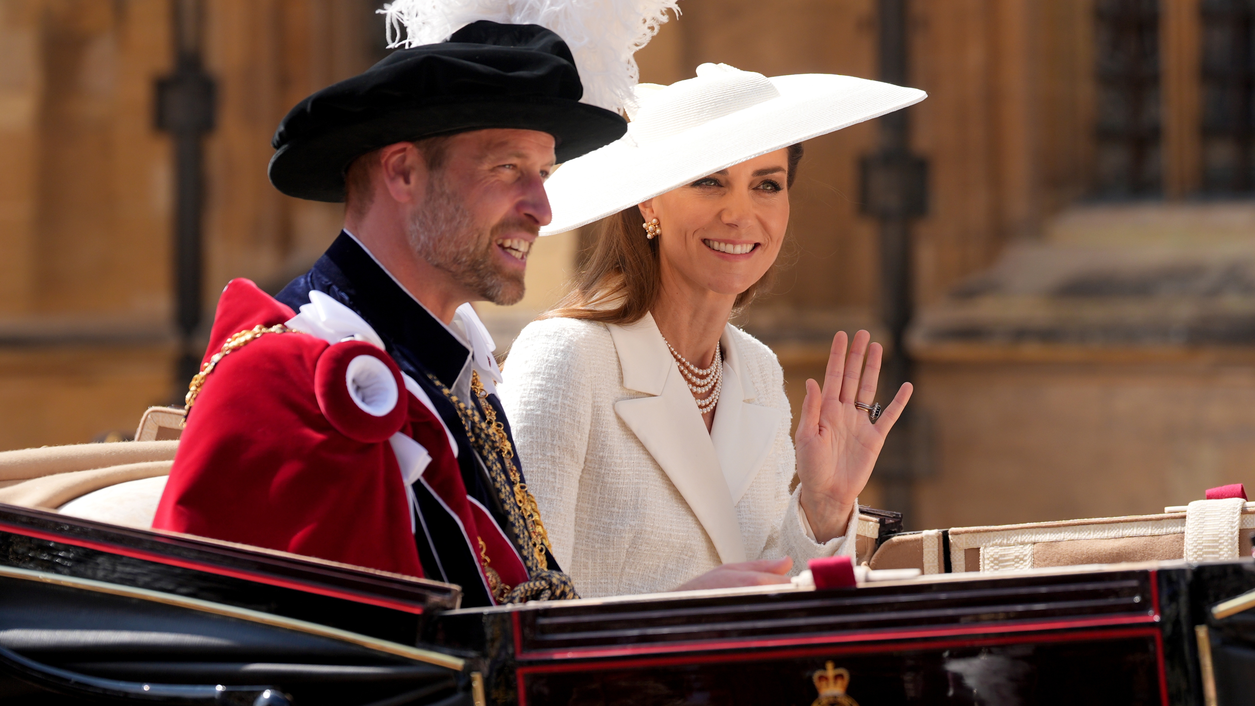 Prince William and Catherine, Princess of Wales ride in a carriage after attending the Order of the Garter Service at St George's Chapel