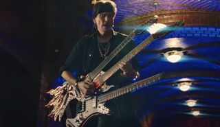 Steve Vai plays his triple-neck Ibanez Hydra guitar