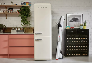 Reebok I Run 4.0 Treadmill folded away next to Smeg fridge