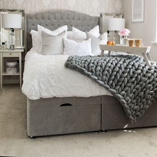 Soft grey carpet with darker grey bed and chunky throw