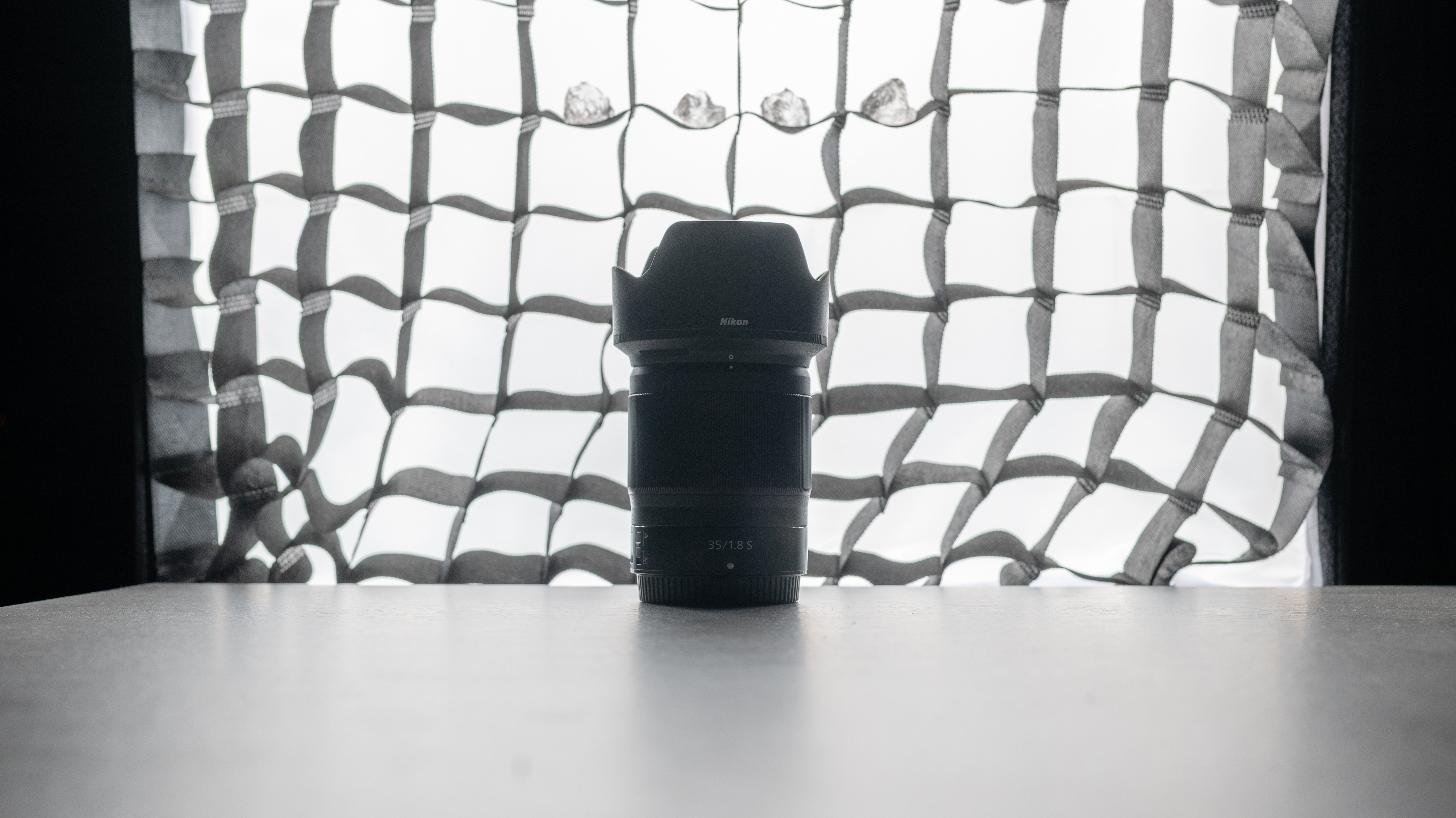 A photo of a backlit lens with a softbox in the background, taken on the Nikon Z50II
