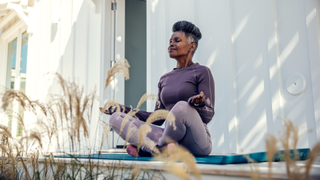 Woman meditating outside