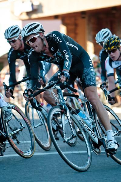 Pure Black Racing riders back in the bunch with a teammate up in the break.