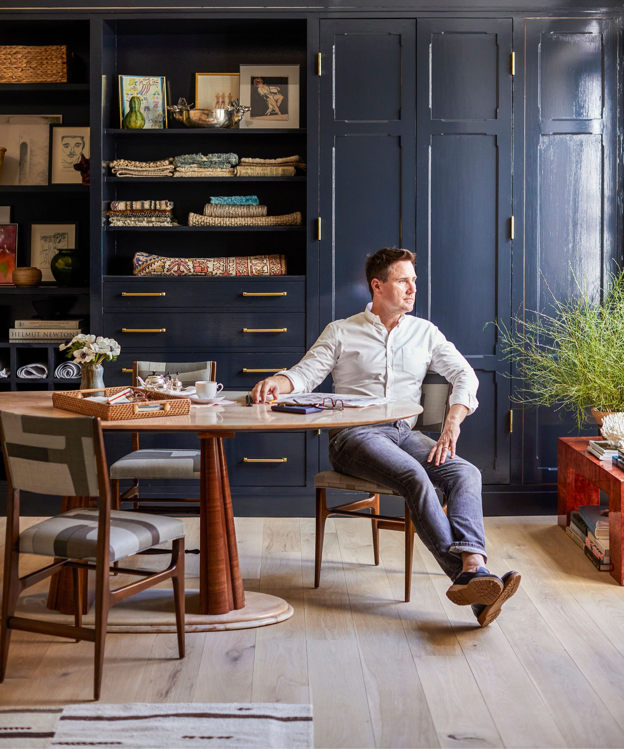 Bryan Graybill sitting at a table in his study at home