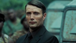 Mads Mikkelsen menacingly stands next to a car in Casino Royale.