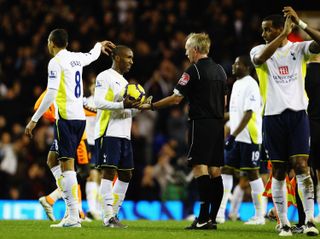 Jermain Defoe gets the match ball after scoring five goals for Tottenham in a 9-1 win over Wigan Athletic at White Hart Lane in November 2009.
