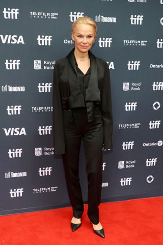 Pamela Anderson wears a black suit, black heels, and minimal makeup to the premiere of The Last Showgirl at the 2024 Toronto International Film Festival on September 06, 2024