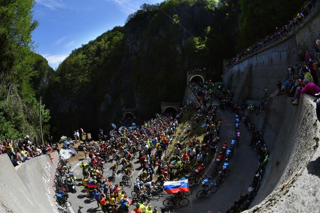Movistar leads the peloton up a climb on stage 19