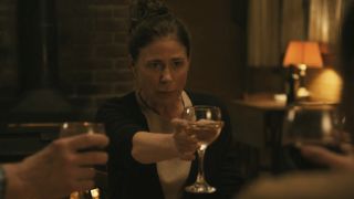 Maura Tierney holding up a wine glass during the American Rust: Broken Justice finale