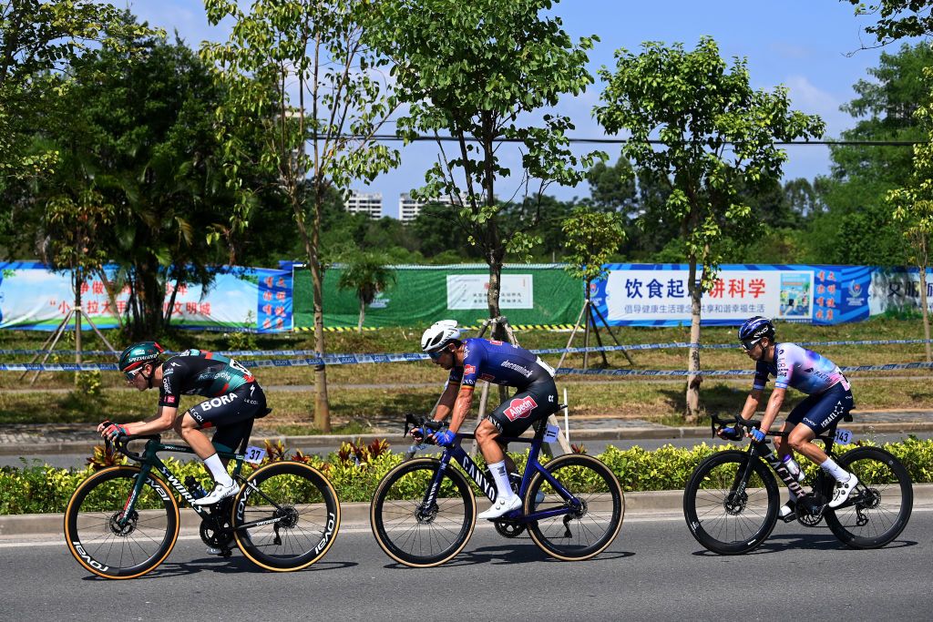 BEIHAI CHINA OCTOBER 12 LR Frederik Wandahl of Denmark and Team BORAHansgrohe Dries De Bondt of Belgium and Team AlpecinDeceuninck and Omer Goldstein of Israel and Team IsraelPremier Tech compete in the breakaway during the 4th GreeTour of Guangxi 2023 Stage 1 a 1356km stage from Beihai to Beihai UCIWT on October 12 2023 in Beihai China Photo by Tim de WaeleGetty Images