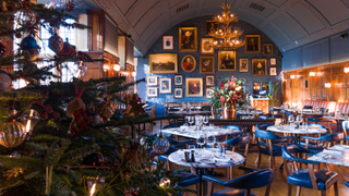 Interior of The Lygon Arms with a Christmas tree in the foreground