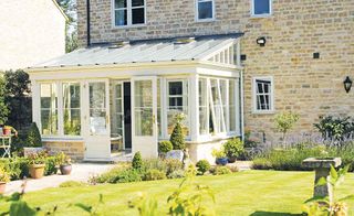 Conservatory extension to stone-clad property