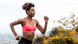 Woman running wearing Brooks Dare Strappy Run Bra