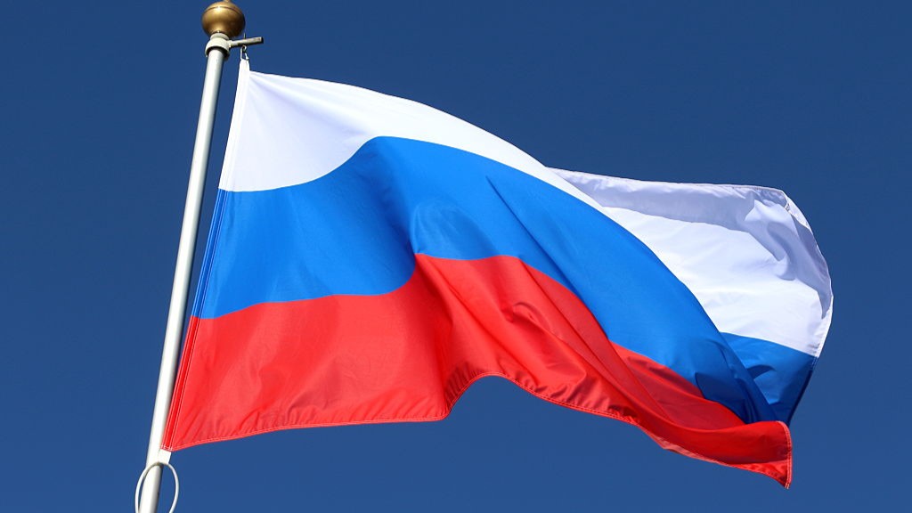  The national flag of the Republic of the Russian Federation, fluttering in the wind on a flagpole