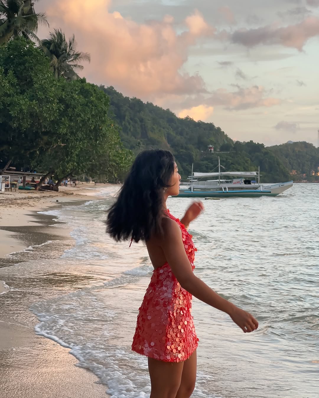 woman wearing sequin mini dress on vacation summer 2025
