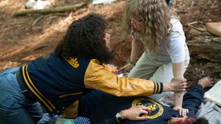 Jasmin Savoy Brown as Teen Taissa and Samantha Hanratty as Teen Misty in Yellowjackets.