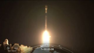 A SpaceX Falcon 9 rocket launches on its 11th mission, a record for a single booster, carrying 52 Starlink internet satellites into orbit from Vandenberg Space Force Base in California on Dec. 18, 2021.