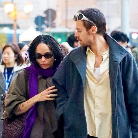 Zoe Kravitz wearing a purple scarf with Harry Styles in Rome