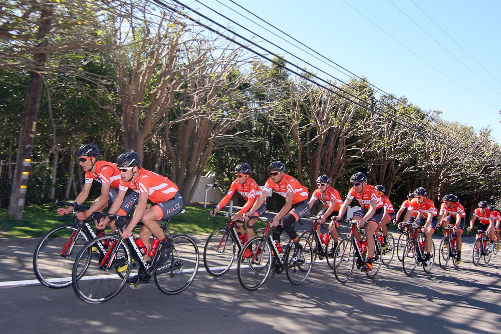 The Rally Cycling team in formation near Malibu Beach.