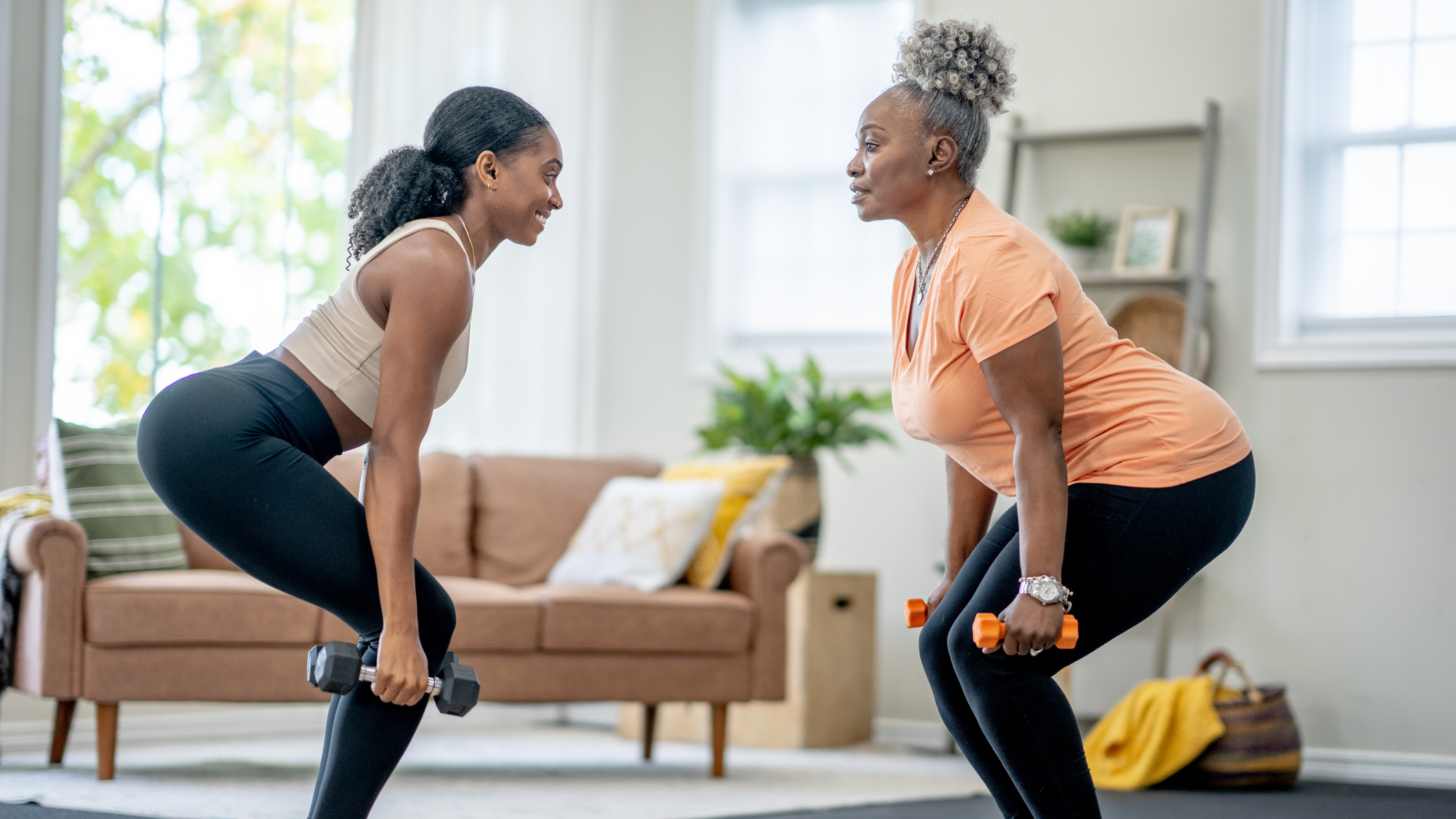Two women exercising in a domestic setting