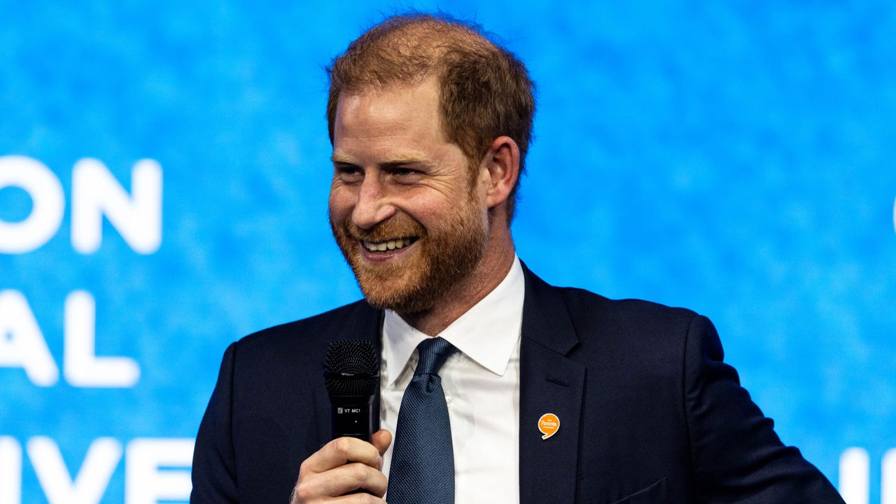 Prince Harry smiles while holding a microphone at the the Clinton Global Initiative in New York on September 24, 2024