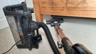 Shark PZ1000UKT vacuuming under the bed with powered lift-away