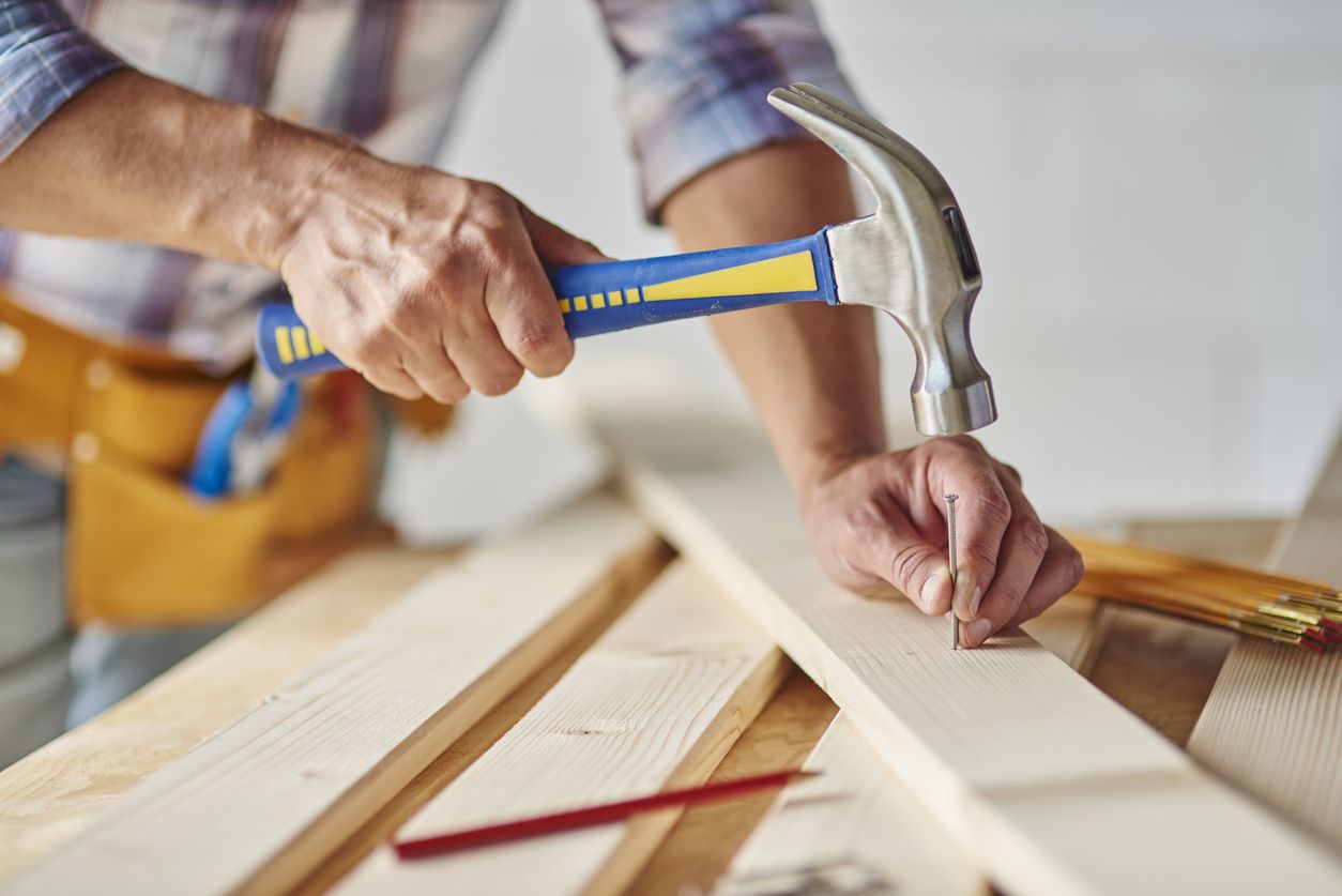 A person using a hammer.