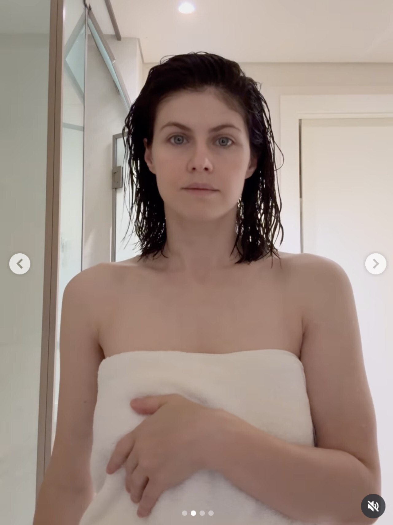 Alexandra Daddario fresh from the shower wearing nothing but a towel.