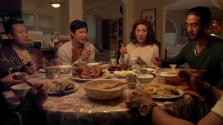 TK, Eileen, Bruce, and Charles sit down to eat in Netflix's The Brothers Sun