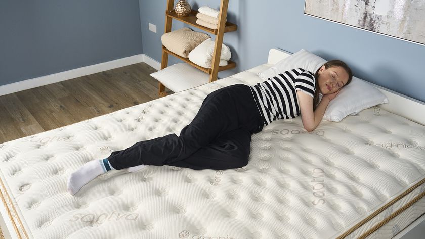 Our tester lies on her side when reviewing the Saatva Classic Mattress