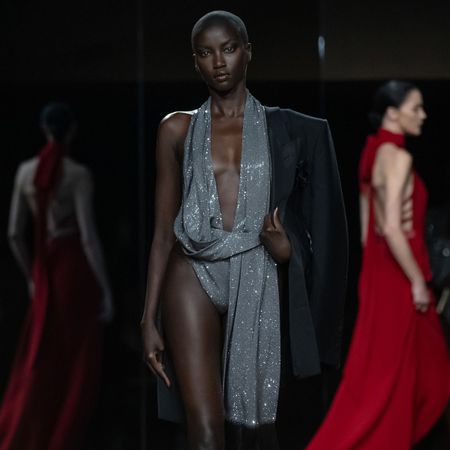 a model at the tom ford shoe wears a sequin bodysuit.