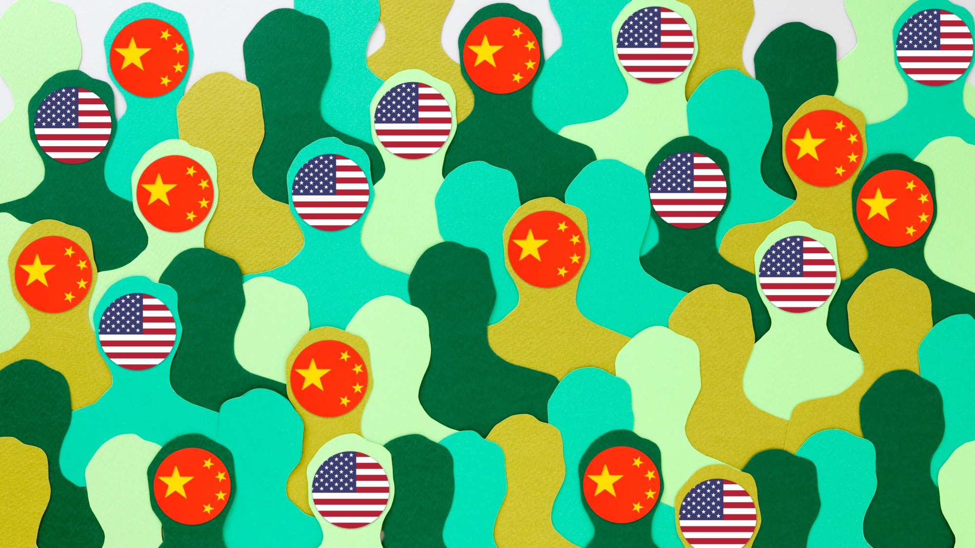 Green paper men silhouettes with American and Chinese flags on their heads