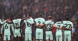 Chelsea players stand as rain falls during the Premier League match between AFC Bournemouth and Chelsea FC at Vitality Stadium on September 17, 2023 in Bournemouth, England.