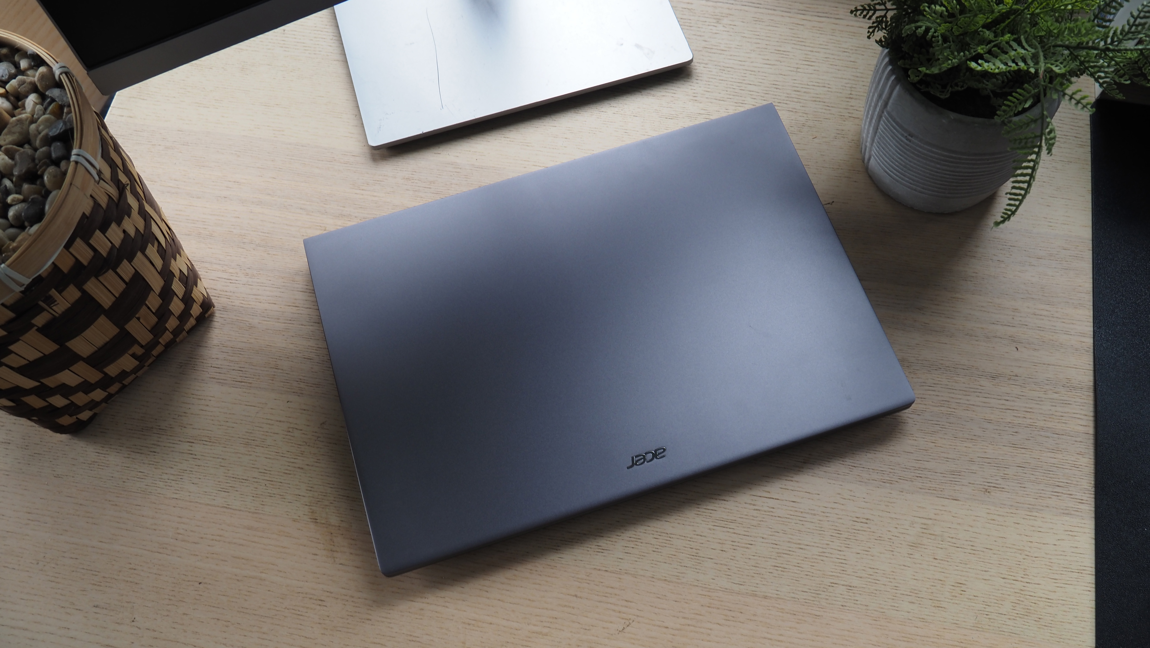An image of an Acer Swift X 14 laptop on a desk