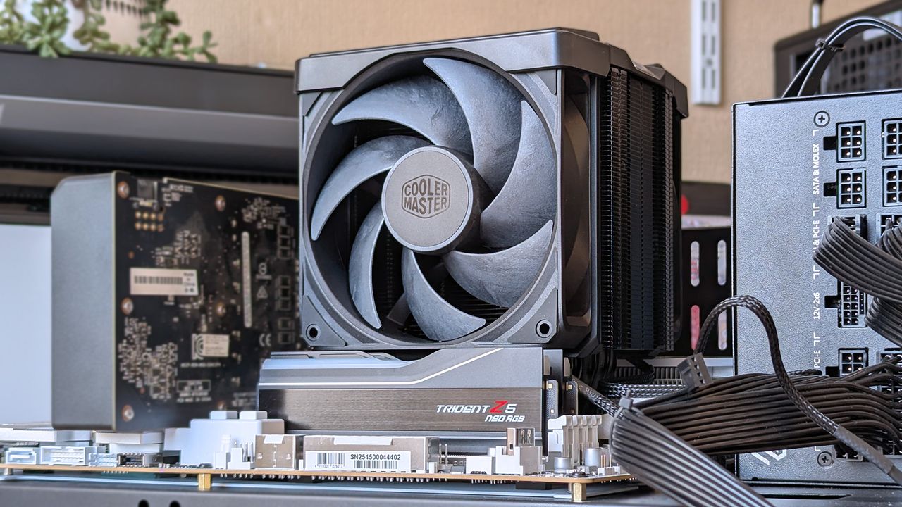 Cooler Master V8 ACE 3DHP installed on a test bench with RAM, power supply, and graphics card visible with various motherboard power cables.