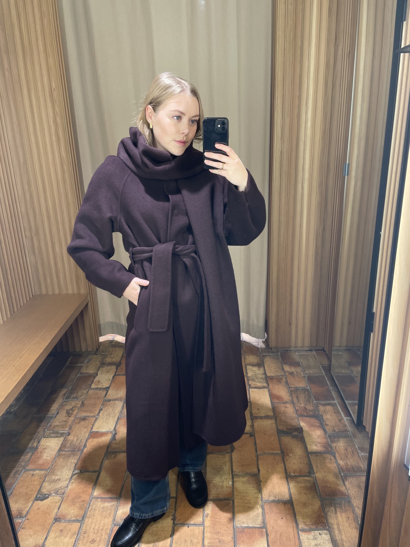 An image of Shopping Editor Florrie Alexander wearing a chic scarf coat.