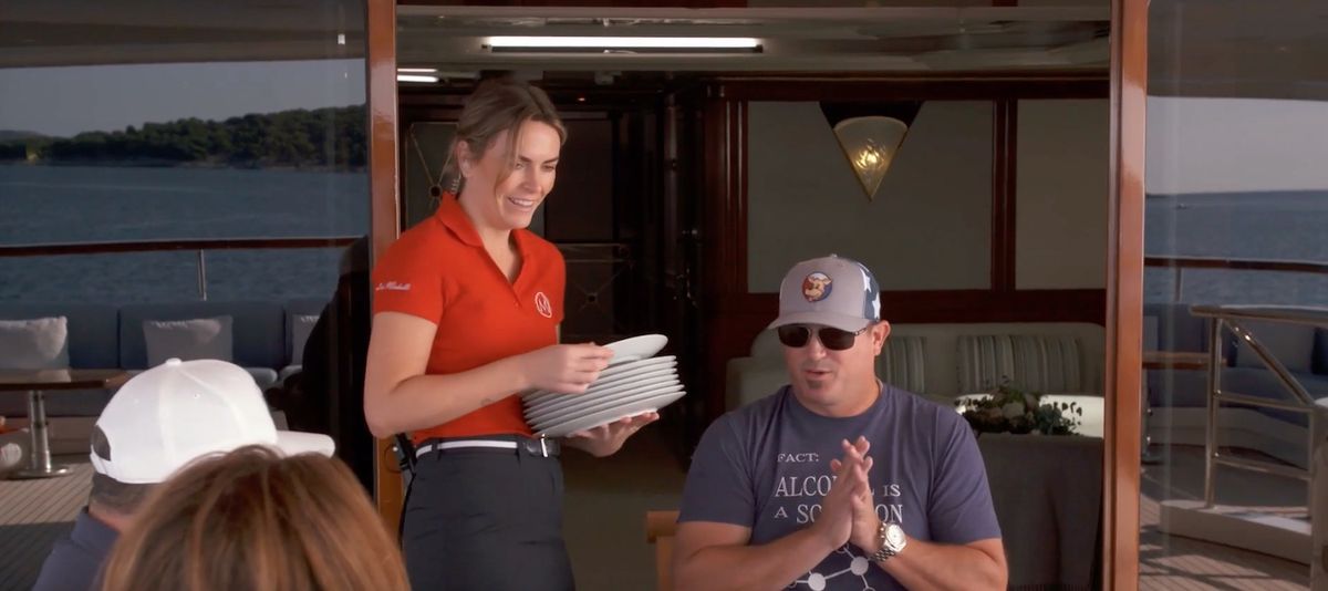 Chief Stew Katie brings plates for their charter guests after Lexi forgot them while taking pictures of the sunrise on the latest episode of &#039;Below Deck Mediterranean&#039;.