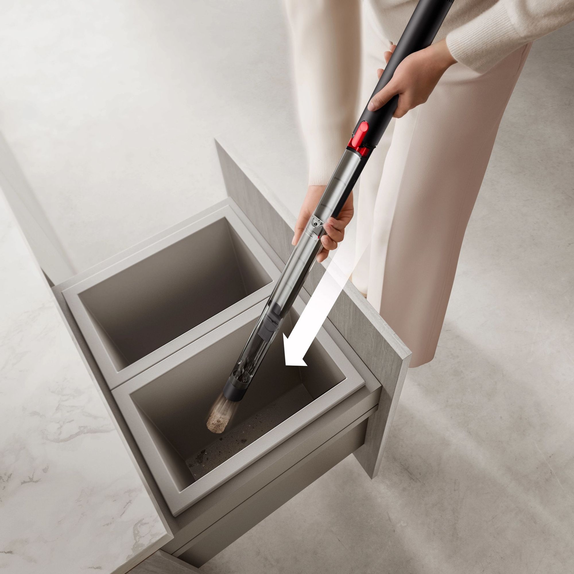 Emptying the Dyson PencilVac into a drawer bin