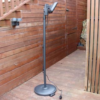 The back of the Devola Core 2kW Freestanding Patio Heater whilst being tested on wooden decking