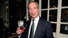Nigel Farage poses with a pint